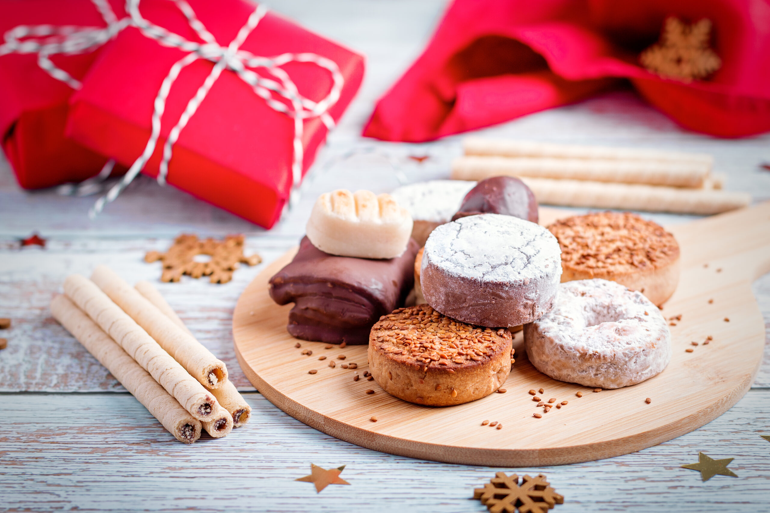 Traditional Spanish Christmas sweets turron, polvorones, mantecados on grey table top